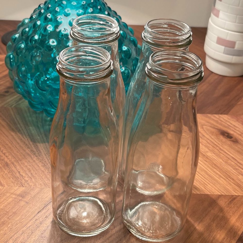Set of four milk bottle shaped glasses - no lids